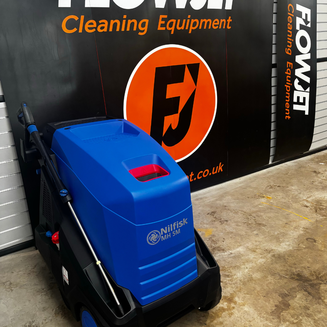 Nilfisk MH5M Flow Actuated Pressure Washer with hose and accessories, designed for high-efficiency cleaning.